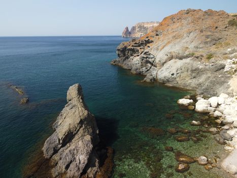 Aerial panoramic view of beautiful sunset above sea. Beautiful seascape. Sun glare, small waves on the water surface. Evening. Horizon. Nobody. No people. Copy space. Never-ending beauty of nature