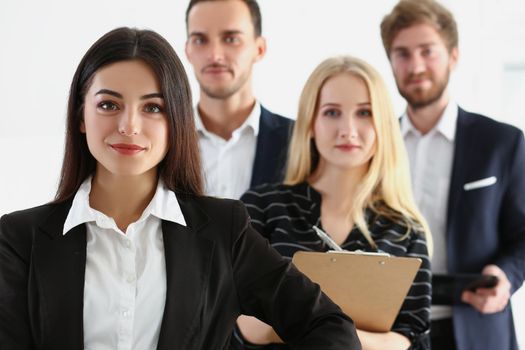 Portrait of confident team of successful people, men and women coworkers pose for collective picture. Employees in trendy suits. Business, teamwork concept