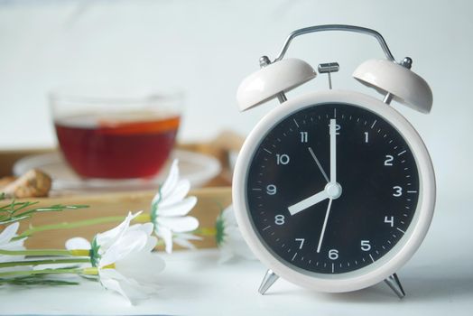 coffee mug, and clock on table close up .