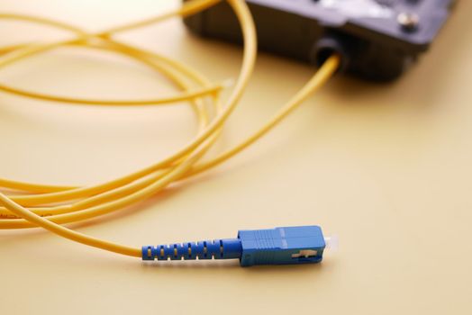 Wi-Fi router with cables on table .