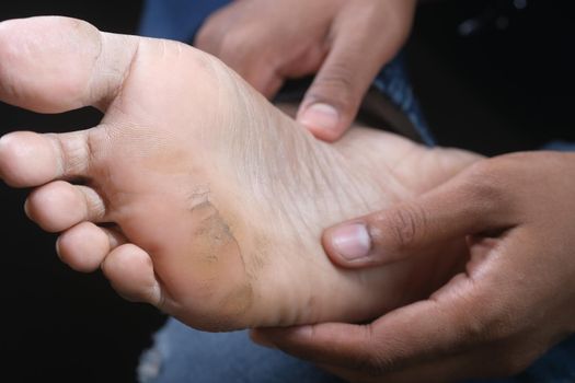 close up of young men dry feet on bed