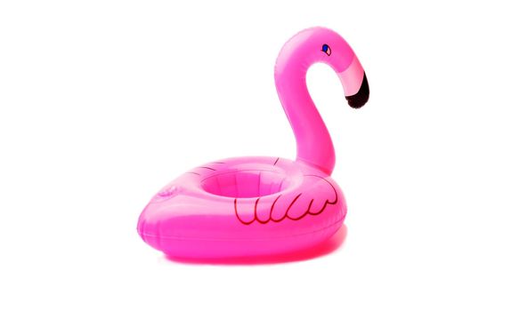 inflatable little flamingo on an isolated white background. Cup holder for the pool. Concept of summer time. Beach summer composition.