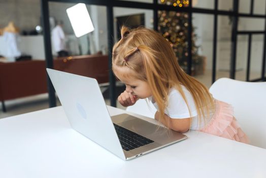 Happy little girl using tablet computer