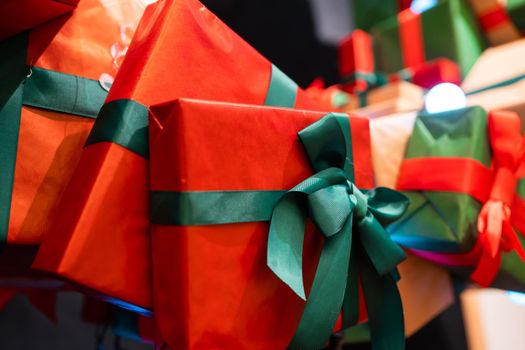 Gift boxes with ribbons of different colors, close angle