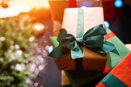 Gift boxes with ribbons of different colors, close angle