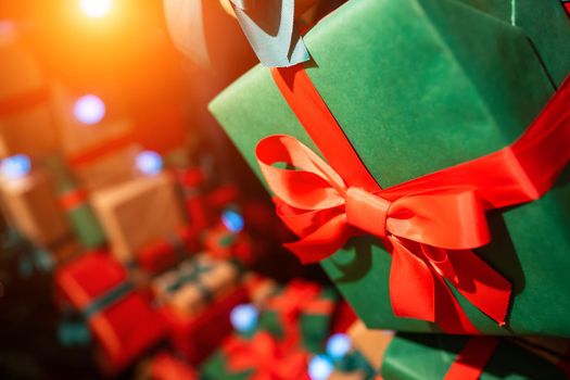 Gift boxes with ribbons of different colors, close angle