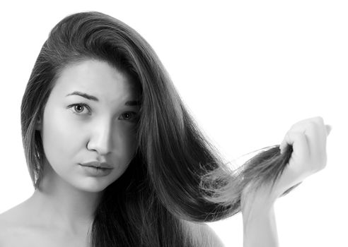 woman is not happy with her fragile hair, white background, copyspace