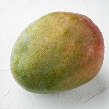 Mango whole fruit set, on white stone table background, square format
