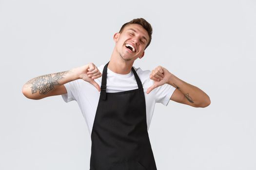 Employees, grocery stores and coffee shop concept. Handsome happy and pleased barista, waiter become employee of month, pointing at himself proud and delighted, white background.