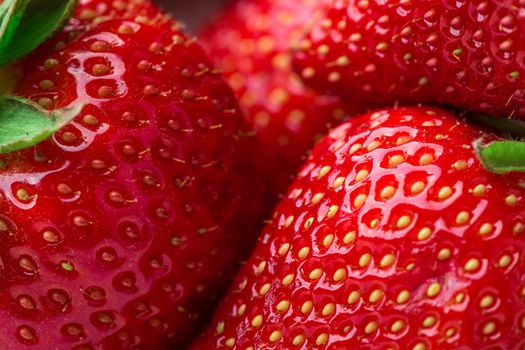 Red Strawberry, red close up strawberries with selective focus on a strawberry with many strawberries in the background for food or fruit close up background or strawberry texture.