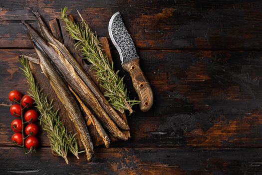 Lamprey with herbs set, on old dark wooden table background, top view flat lay, with copy space for text