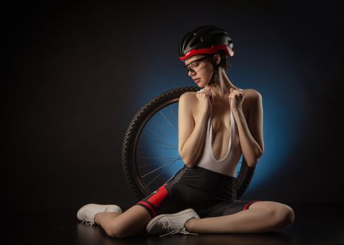 the a girl in a Bicycle suit with a helmet