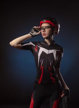 the girl cyclist in a helmet