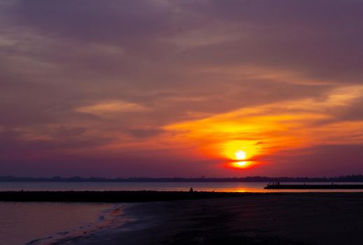 Sunset beach silhouette free styles in holiday ,water  sky and people.