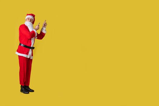 Santa claus yellow funny big, fat tradition man elderly happy. Trendy diet. Ruks at the top shows