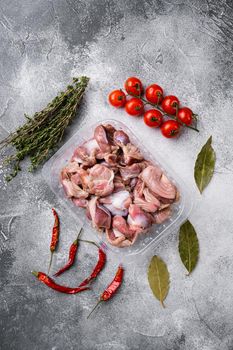 Chicken stomach container set, on gray stone table background, top view flat lay