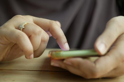 close up of women hand holding smart phone.