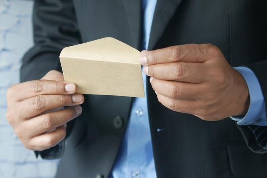 businessman open a envelope close up.