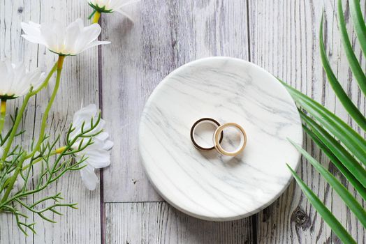 wedding ring in a box on red background