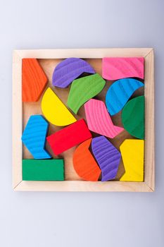 Colorful wooden pieces of a logic puzzle