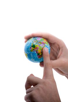 Child holding a small globe in hand on white background