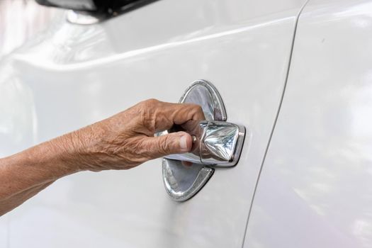 Elderly woman open car door at home elderly,senior,senior