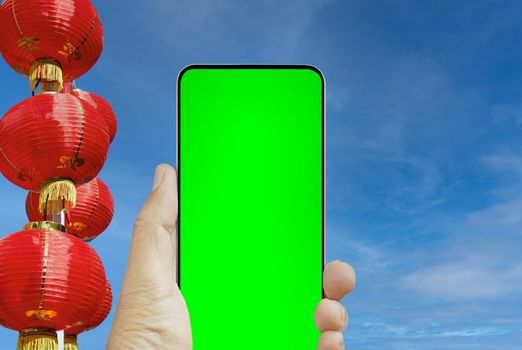 Cell phone in chinese lunar new year,  chroma key screen.