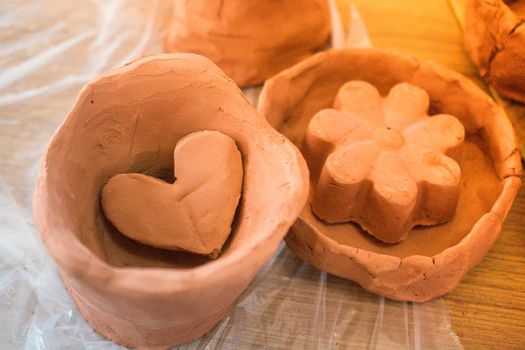 Heart shaped clay object as love concept