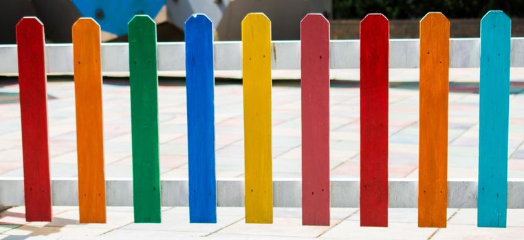 Close up of a part of decorative colorful wooden fence