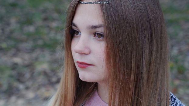 Beautiful girl posing in the autumn evening. Face close-up