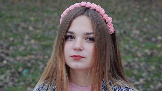 Beautiful girl posing in autumn evening. Face close-up