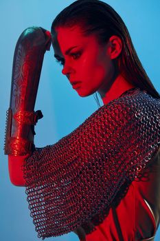 photo pretty woman red light silver armor chain mail fashion Lifestyle unaltered. High quality photo