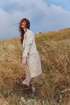 woman wheat countryside landscape freedom autumn season concept. High quality photo