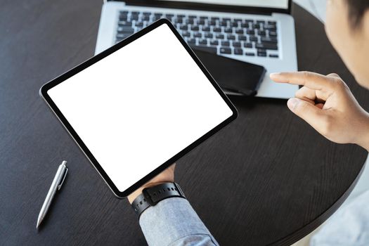 A man holding a tablet with a blank white screen. The blank space on the white screen can be used to write a message or place an image