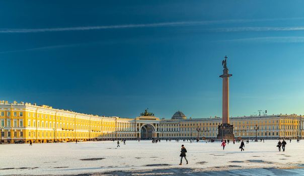 Russia, Saint-Petersburg, 1 March 2016: Palace Square in winter, Alexander Column, Winter Palace, the arch of the Main Staff at sunset, the designer Rossi triumphal chariot. High quality photo