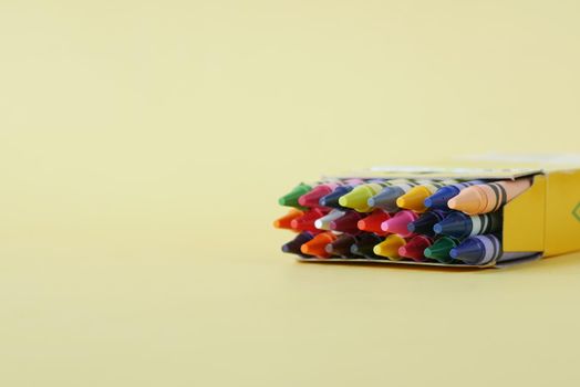 Color pencils on a papers on table .