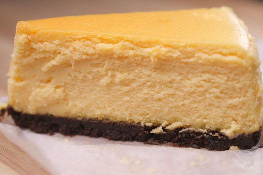 chocolate and cream cake on a plate on table .