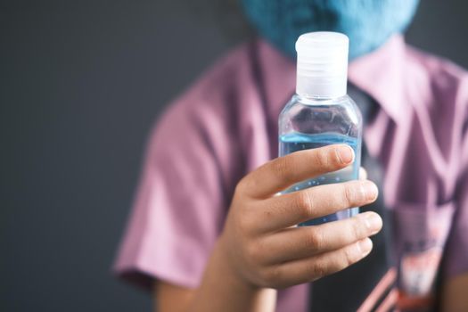 child hand using sanitizer gel for preventing virus with copy space ,