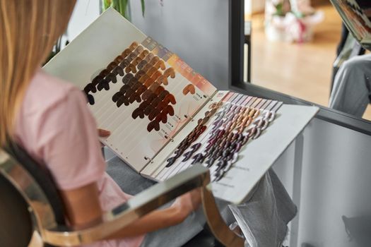 Happy beautiful light hair caucasian woman at beauty salon