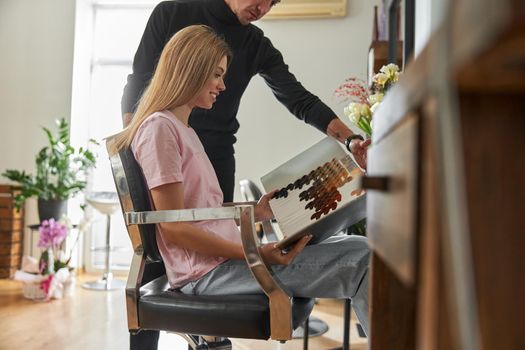 Happy beautiful light hair caucasian woman at beauty salon