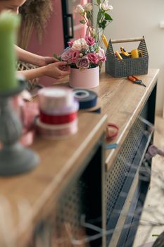 happy professional woman is working in flower shop