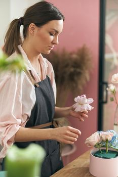 happy professional woman is working in flower shop