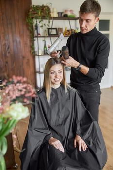 Hair drying process in modern hairdresser's salon