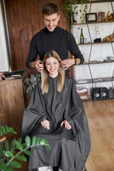 Happy beautiful light hair caucasian woman at beauty salon