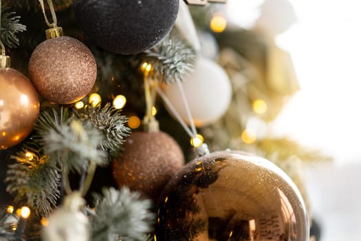 Christmas tree decoration close up background. Garland, balls, illuminated lights. Merry Christmas and Happy New year