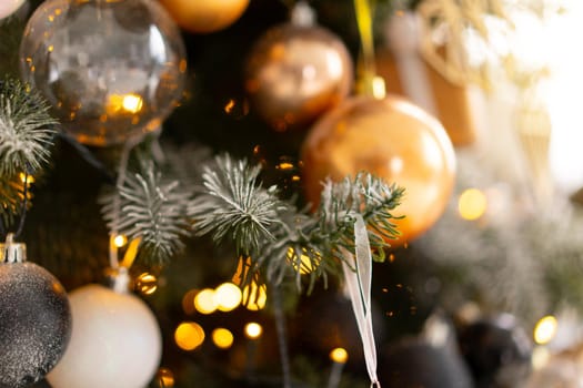 Christmas tree decoration close up background. Garland, balls, illuminated lights. Merry Christmas and Happy New year