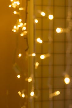 Christmas lights at night. Blurred background. Festive concept. Space for copying. Bokeh, selective soft focus.