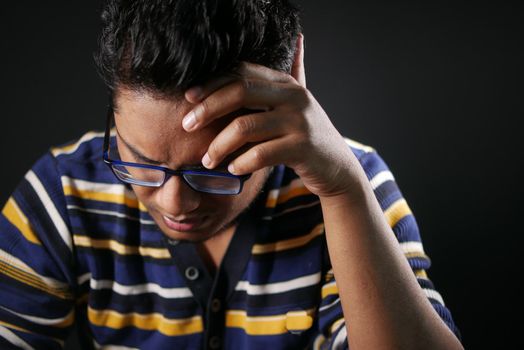 Depressed man feeling sick and worried about financial problem.