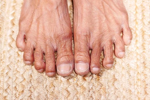 top view of senior women feet on floor