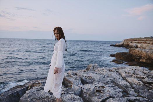 Attractive woman enjoying for view of the beautiful sea on her holiday nature. High quality photo